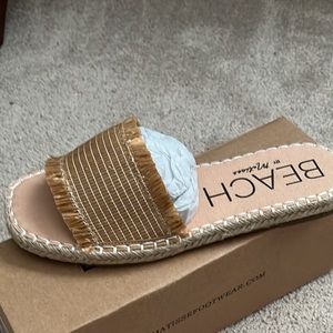 Cute slide sandals reminiscent of espadrilles. Size 9 new in box. Summer fun!